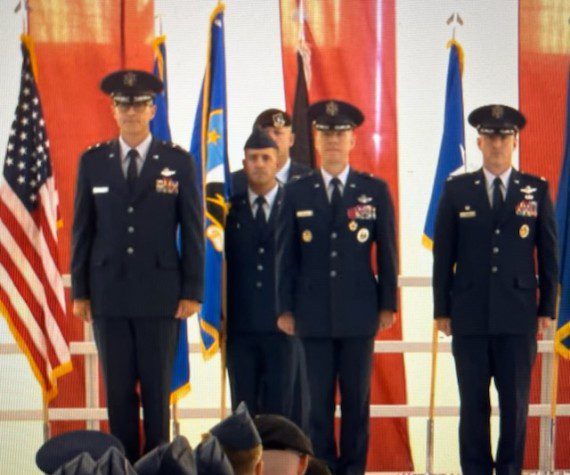 The 412th Test Wing change of command saw Brig. Gen. Douglas P. Wickert, center, command to his successor, Col. Thomas M. Tauer, right. Presiding over there ceremony was Maj. Gen. Scott A. Cain, commander of the Air Force Test Center. The ceremony was held at Edwards AFB, Calif., July 29, 2025. (Air Force photograph)