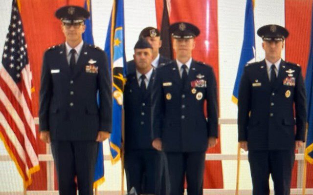 The 412th Test Wing change of command saw Brig. Gen. Douglas P. Wickert, center, command to his successor, Col. Thomas M. Tauer, right. Presiding over there ceremony was Maj. Gen. Scott A. Cain, commander of the Air Force Test Center. The ceremony was held at Edwards AFB, Calif., July 29, 2025. (Air Force photograph)
